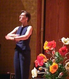 Interpreter in dramatic pose at concert